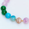 Multicolored beaded bracelet on a white background
